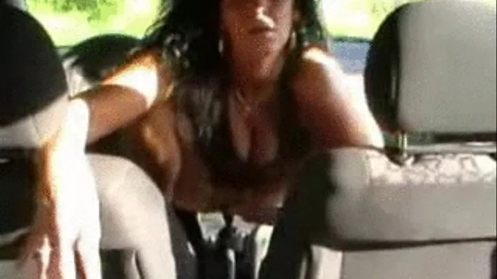 Dark Haired MILF fucking and cumming on the gear shifter in her man's sports car