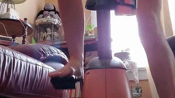 Bare feet & legs on the exercise bike