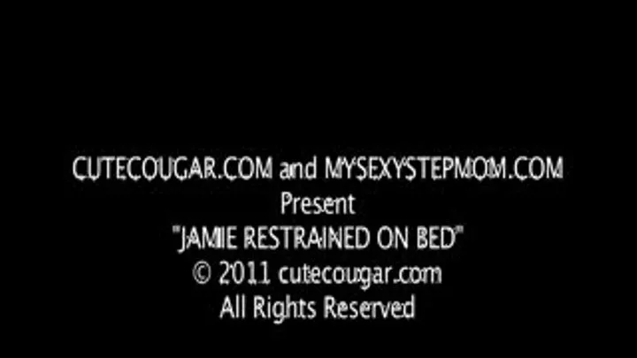 Jamie Restrained on the Bed