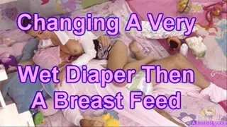 Changing A Very Wet Diaper Then A Breast Feed