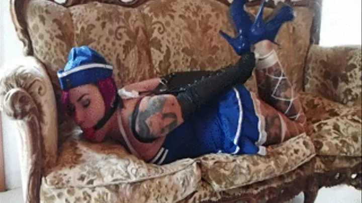 Giada Marine hogtied with armbinder and ropes on a couch