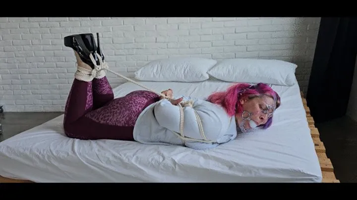 Alison hogtied on a bed!