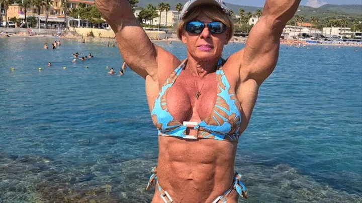 Sexy muscle posing on the beach in Southern France