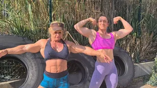 Two muscle ladies posing and training