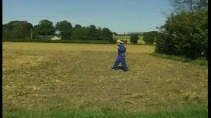 Mature Domina in Uniform with slaves on her farm