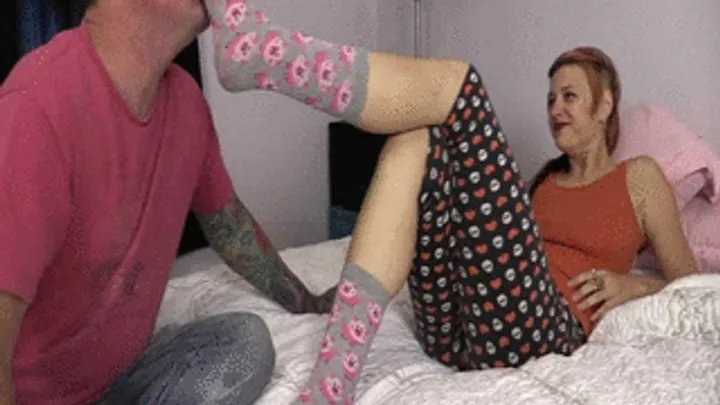 Mistress Bianca is enjoying teasing her slave with her smelly socks dangling them at his nose