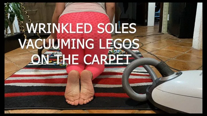 WRINKLED SOLES VACUUMING LEGOS ON THE CARPET