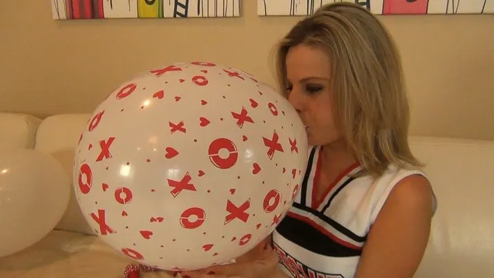 CHEERLEADER ROXIE BLOWS UP BALLOONS FOR THE GAME