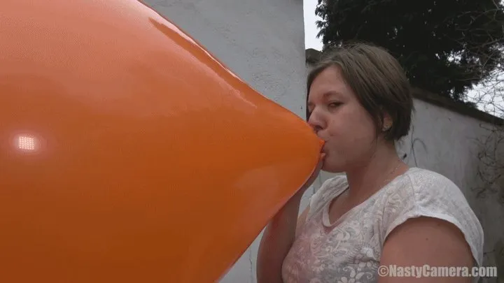 Simona blowing giant balloon