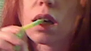 Lexie eats gummy worms closeup PC