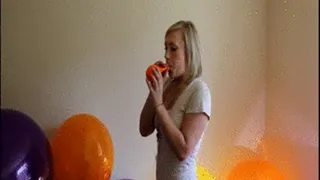 Kourtney blow to pop orange balloon - in room full of balloons!