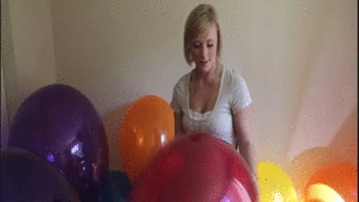 Kourtney pops balloons by biting them!