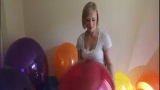 Kourtney pops balloons by biting them!