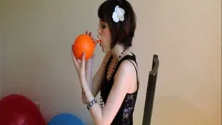 Sunny orange balloon blow to pop