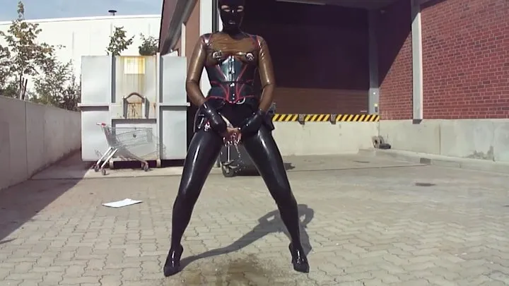 Pierced Latex Doll PEE Masturbates Monster Rubber Dildo and Pee in Black Stocking Micro Skirt Corset Mask Blouse and Gloves Stretched Nipples in Public P2