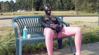 Latex Girl Fucks herself and Sucks Rubber Dildo in Public close busy road with piercing out