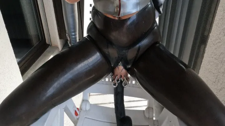 Latex Pierced Girl in black Mask and silver blouse in the balcony fucking huge rubber dildo and piercings Out in Public PART I