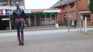 Pierced Latex Girl in Transparent Jeans, Stockings, Blouse, Jacket, Demask Corsett Mask and Gloves walks in the town with piercings rings hanging out & Butt Plug Part III