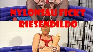 Nylon whore fucks her giant dildo
