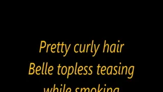 Pretty curly hair Belle topless teasing while smoking