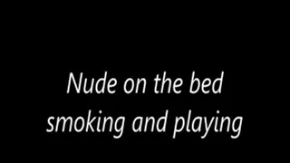 Nude on the bed smoking and playing