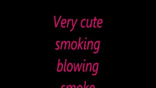 Very cute smoking blowing smoke