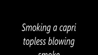 Smoking a capri topless blowing smoke