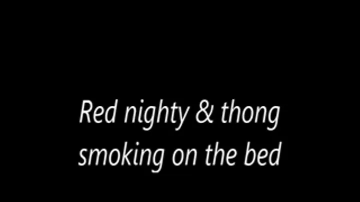 Red nighty & thong smoking on the bed