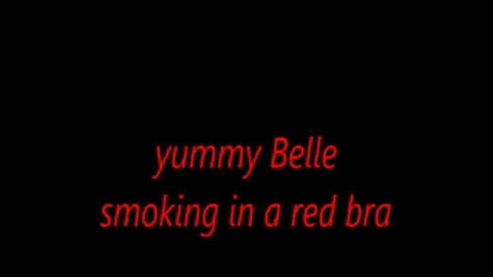 yummy Belle smoking in a red bra