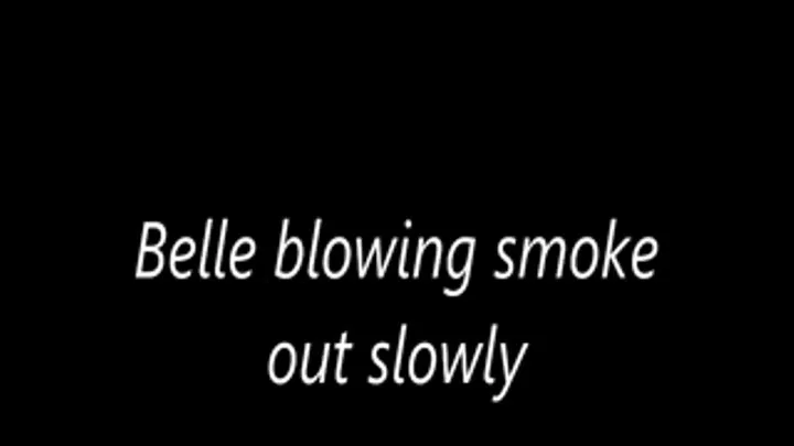 Belle blowing smoke out slowly