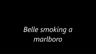 Belle smoking a Marlboro