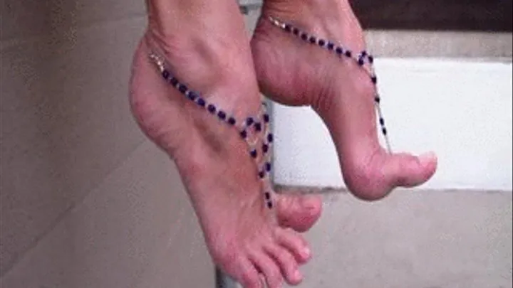 Penny Dangles Her Jeweled Arches