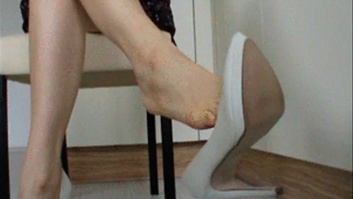 Dangling my white high heels