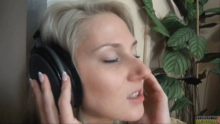 Blonde wearing headphones while having sex