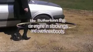 checking the car engine in stockings and overknees