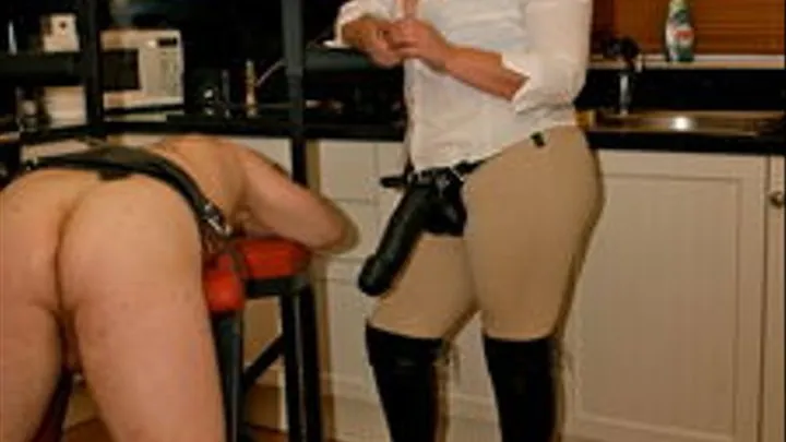 Mistress using a large strap-on