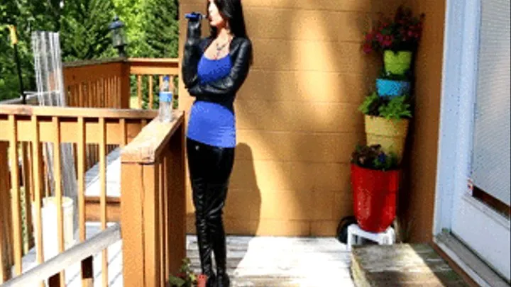 Star Taking Vape Break in Shiny Leggings, Leather Jacket, Boots & Gloves