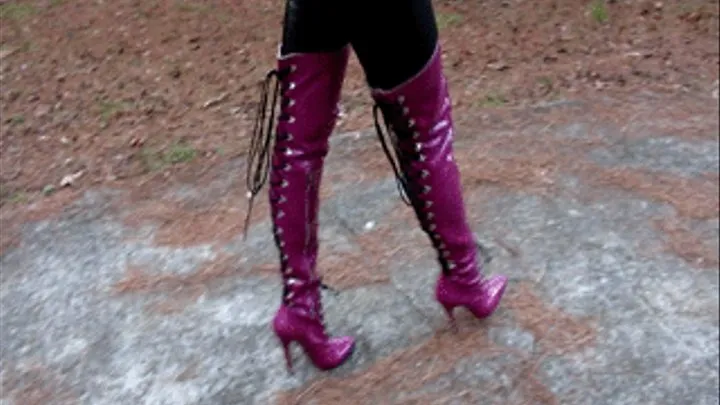 Sydney Spectra Walking on Driveway in Purple Thigh High Boots & Black Leather Outfit