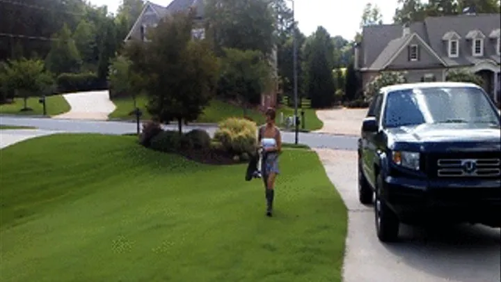 Jane Domino Does Some Edging of the Driveway in Gray Knee High Boots