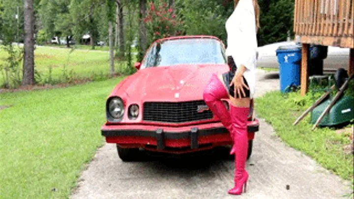 Vassanta Putting On a Show On the Camaro in Pink Thigh High Boots