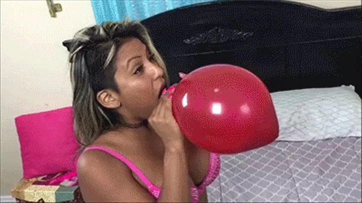 Desiree blows up balloons