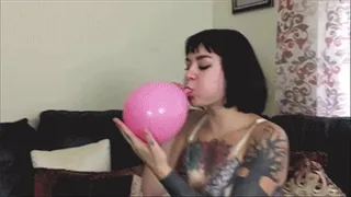 Amelia Dire blows up balloons