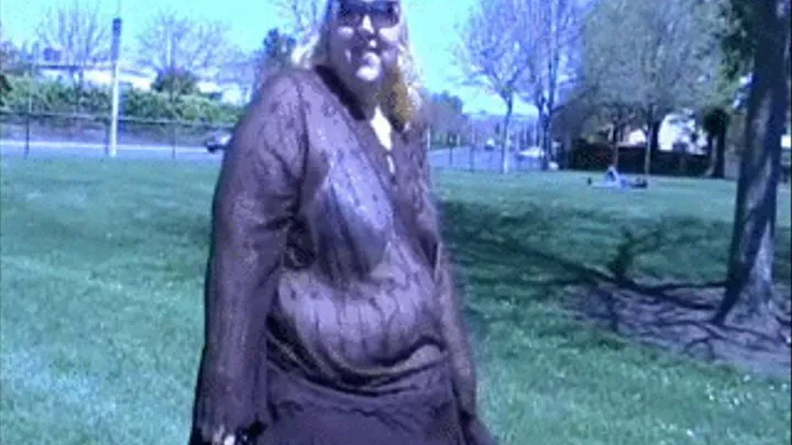 Enormous Blonde, Weighing a Quarter-Ton, Waddling Through a Park