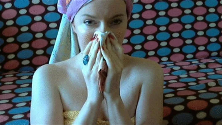 Blowing nose with hair wrapped in a towel