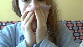 Blowing nose into hankie