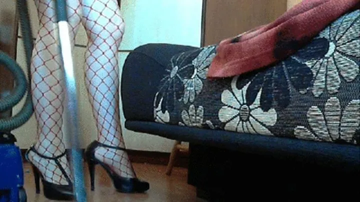 Vacuuming in red fishnet stockings