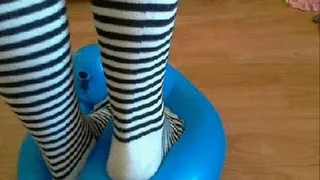 Popping balloons in stipped socks