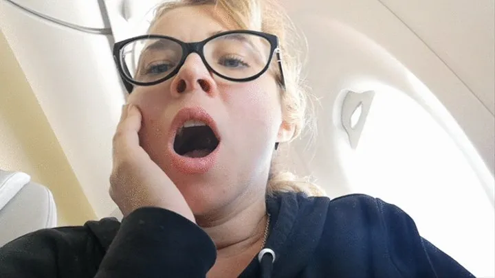 yawning on the plane