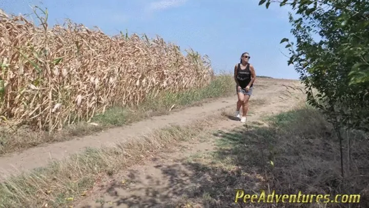 Pee standing on a dirt road in the countryside - Wet her panties outdoor and smoke until they dry