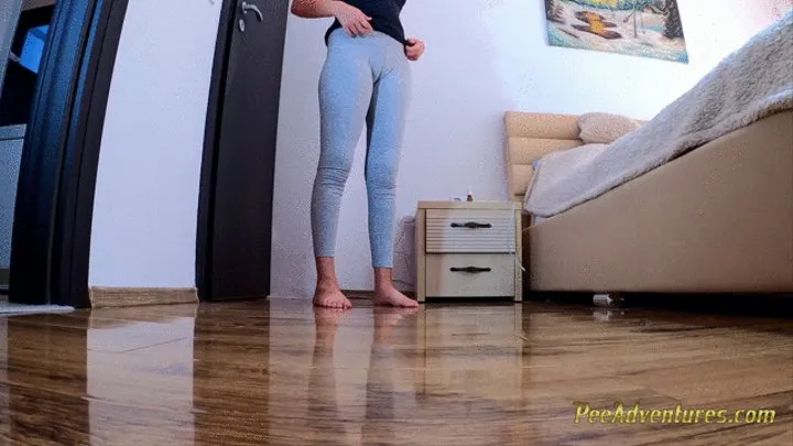 Desperate girl pissing in her tights while cleaning the house